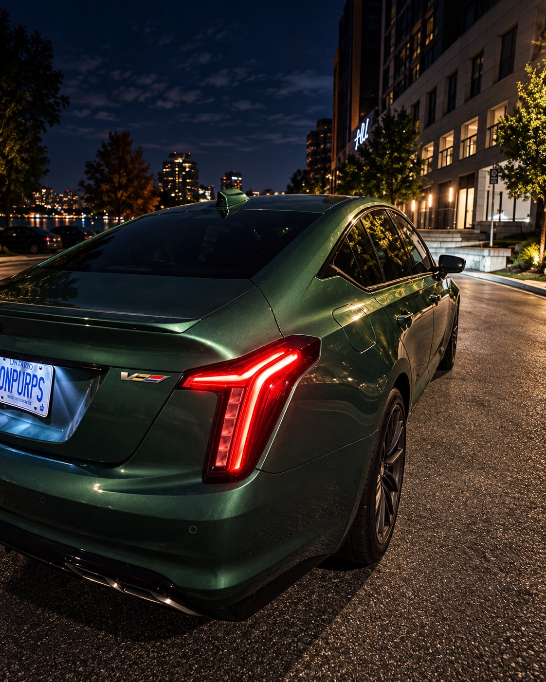 Typhoon Green Cadillac CT5-V rear three quarter view at night