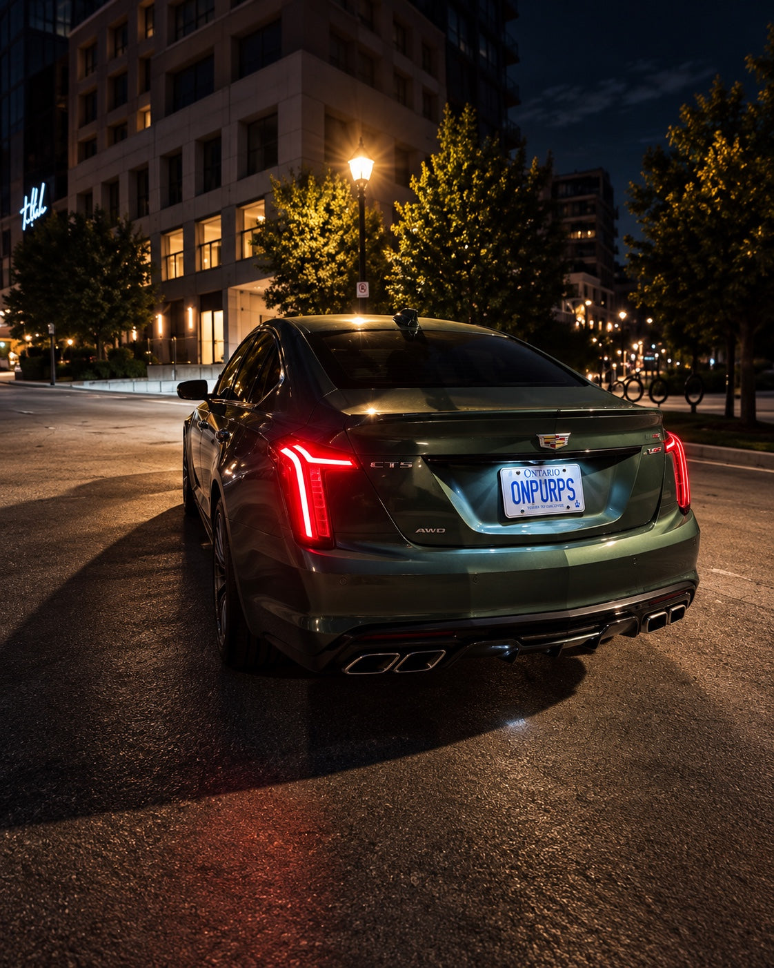 Typhoon Green Cadillac CT5-V rear view at night with ONPURPS plate